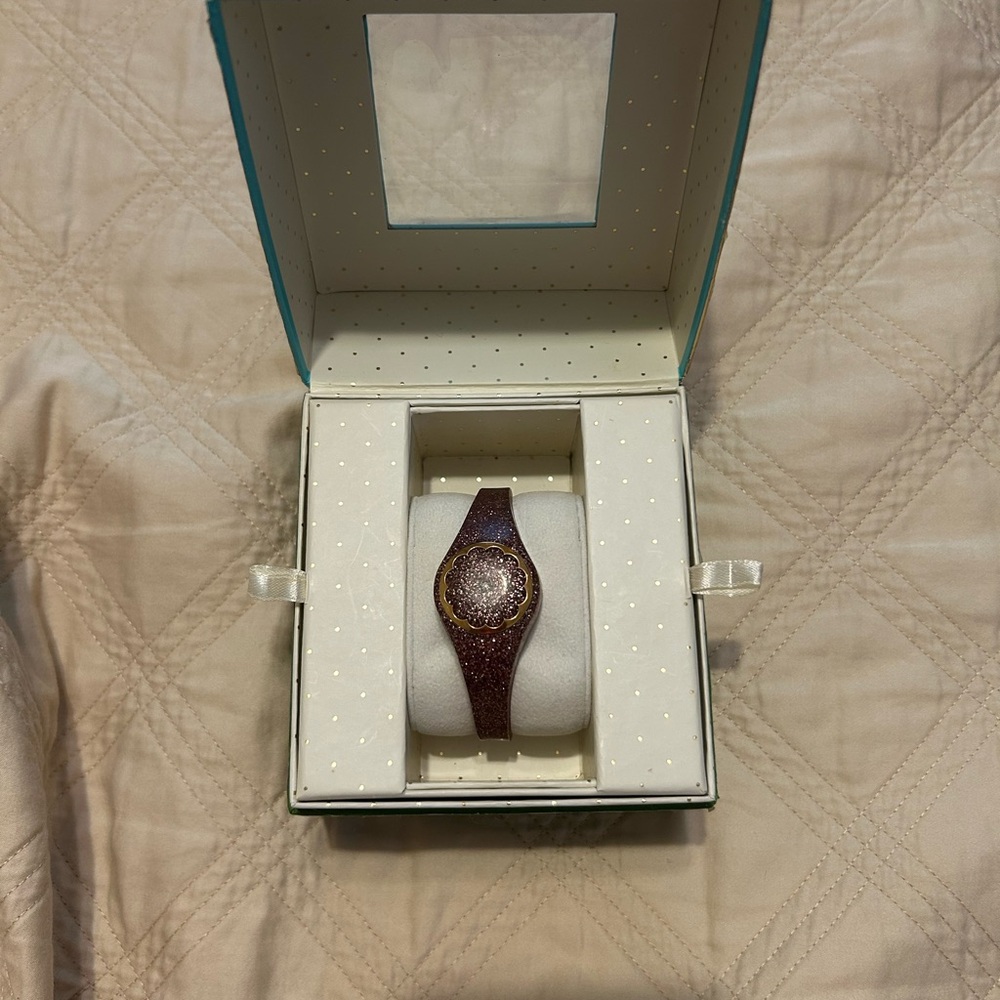 Kate Spade Elegant Rosegold activity Tracker with Gold Accents.